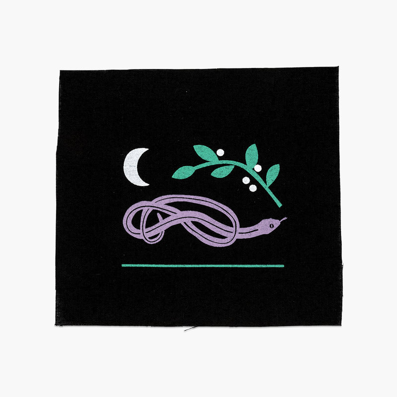 An illustrated patch by Alex Higlett featuring a snake, a moon and a bough of leaves and berries in purple green and white